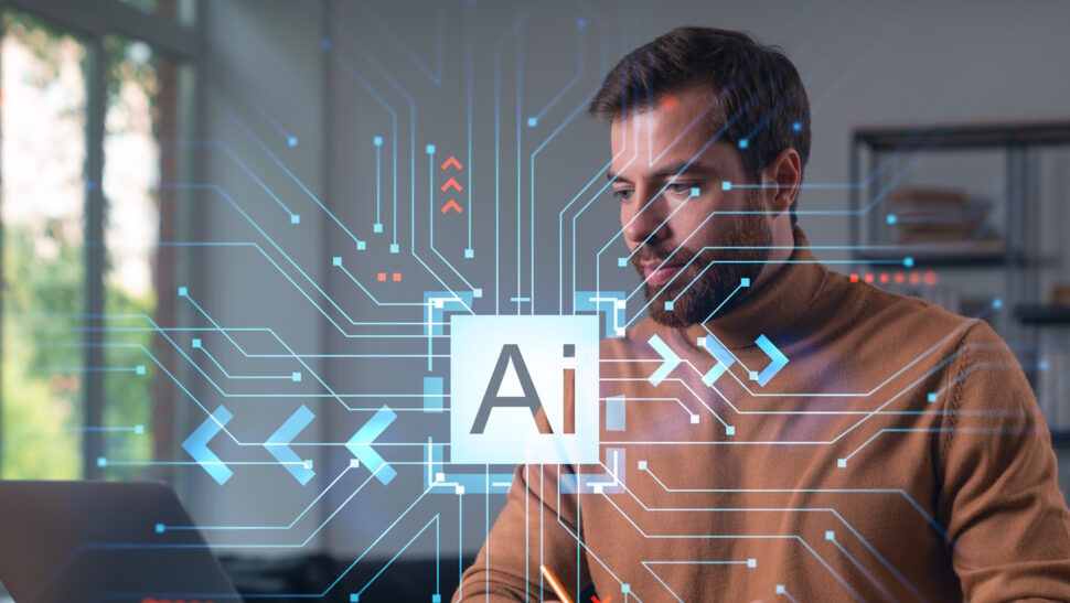 Man met laptop, de term AI in beeld
